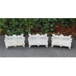 Three white painted cast metal garden planters, 19th century style, one lacking base panel,