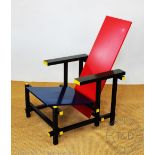 A Cassina red and blue chair originally designed by Gerrit Rietveld,