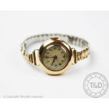 A lady's 15ct gold wristwatch, the circular case enclosing silvered dial with Arabic numerals,