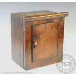 A late 18th century and later Welsh oak and laburnum cabinet, of small proportions,