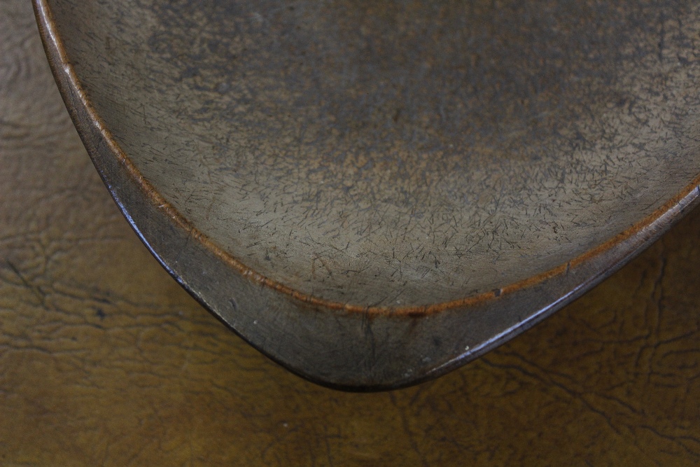 A 19th century vernacular treen sycamore oval settling bowl, 58cm wide Provenance: Clynog Farmhouse, - Image 4 of 8