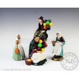 Four Royal Doulton figures comprising; The Balloon Man HN 1954, The Old Balloon Seller HN 1315,