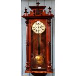 An early 20th century walnut Vienna regulator, with Roman numeral dial,