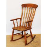 A beech and ash rocking chair, with solid seat,