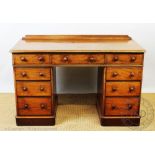 A Victorian mahogany pedestal desk, in the manner of Holland & Sons,