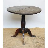 A mid 18th century provincial oak tilt top table,