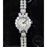 An impressive lady's diamond set cocktail watch,