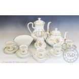 A Paris porcelain tea service comprising; a tea pot, water jug, milk jug, slop bowl,