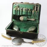 An early 20th century assembled silver travelling dressing case of Gladstone type, initialled S.H.
