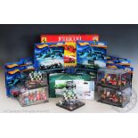 Eighteen boxed diecast motor racing related vehicles,