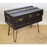 A 1930s metal bound and painted travel trunk,