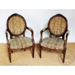 A pair of French carved beech Louis XV style fauteuil, early 20th century,