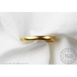 A 22ct yellow gold wedding band, size N, weight 3.