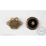 A Victorian mourning brooch, the circular brooch with seed pearl set star to the centre,