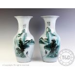 A pair of modern Chinese vases, decorated with a landscape against a pale blue ground, 42.