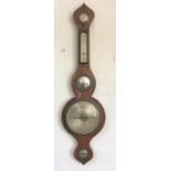 A late George III rosewood wheel barometer, with silvered dial,