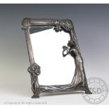 An Art Nouveau style pewter mirror,