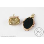 Two stone set fobs, to include; a citrine set example inset with a Masonic intaglio,