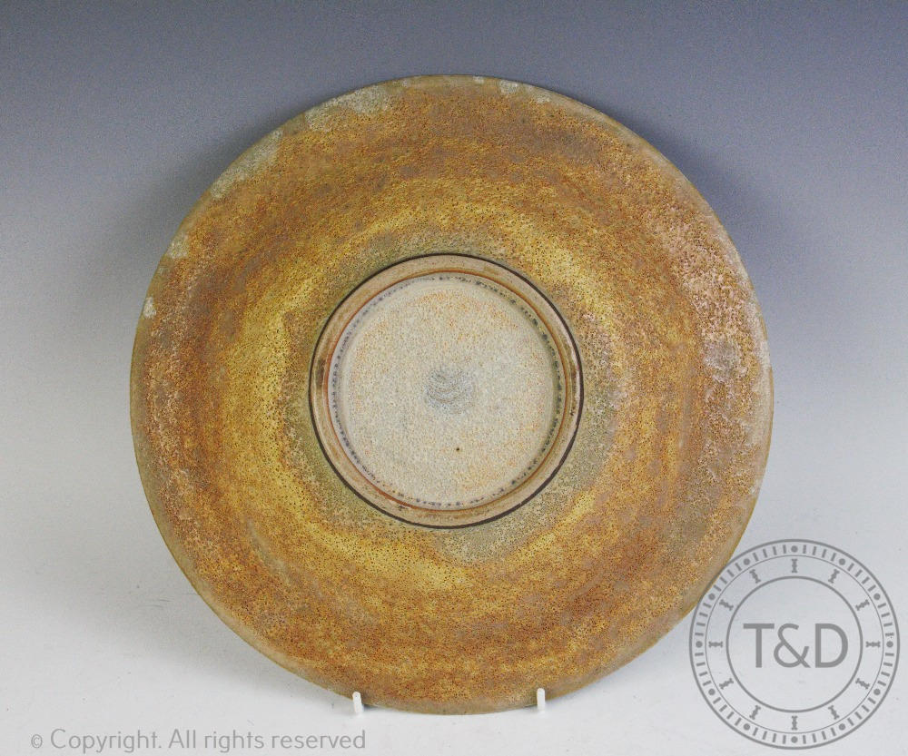 Chris Carter (British b1945) a studio pottery dish, decorated with a textured glaze, - Image 4 of 4