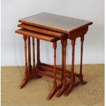 A reproduction nest of tree tables, on turned legs, 58cm H x 53cm W x 35.