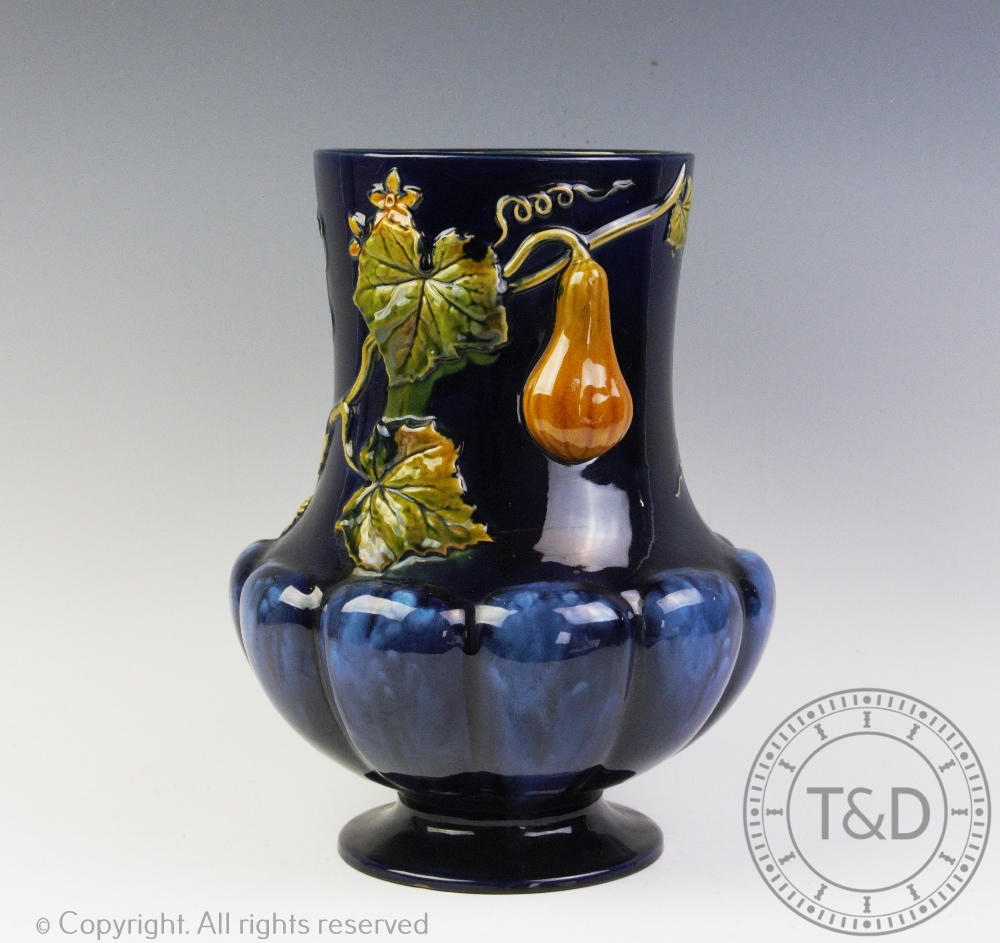 A 19th century Minton majolica vase, of lobed form, decorated with a fruiting vine, impressed marks,