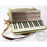 An Italian Casali Verona accordian, with faux mother of pearl case and sequined detailing,