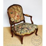 A French Louis XV style carved beech fauteuil, early 20th century,