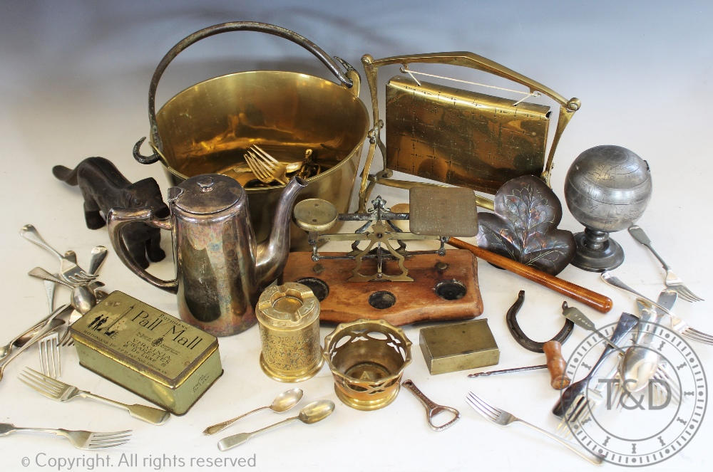 An assortment of brass and other metal wares to include: a brass jam pan, a kitchen scale,