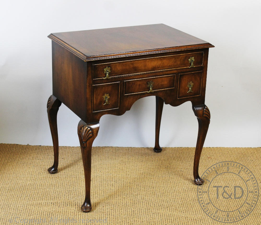 An 18th century style walnut low boy, with an arrangement of four drawers,