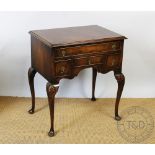 An 18th century style walnut low boy, with an arrangement of four drawers,
