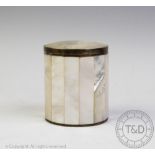 A 19th century mother of pearl and white metal box, of canted cylindrical form with removable cover,