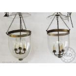 A near pair of glass bell shaped hall lanterns,
