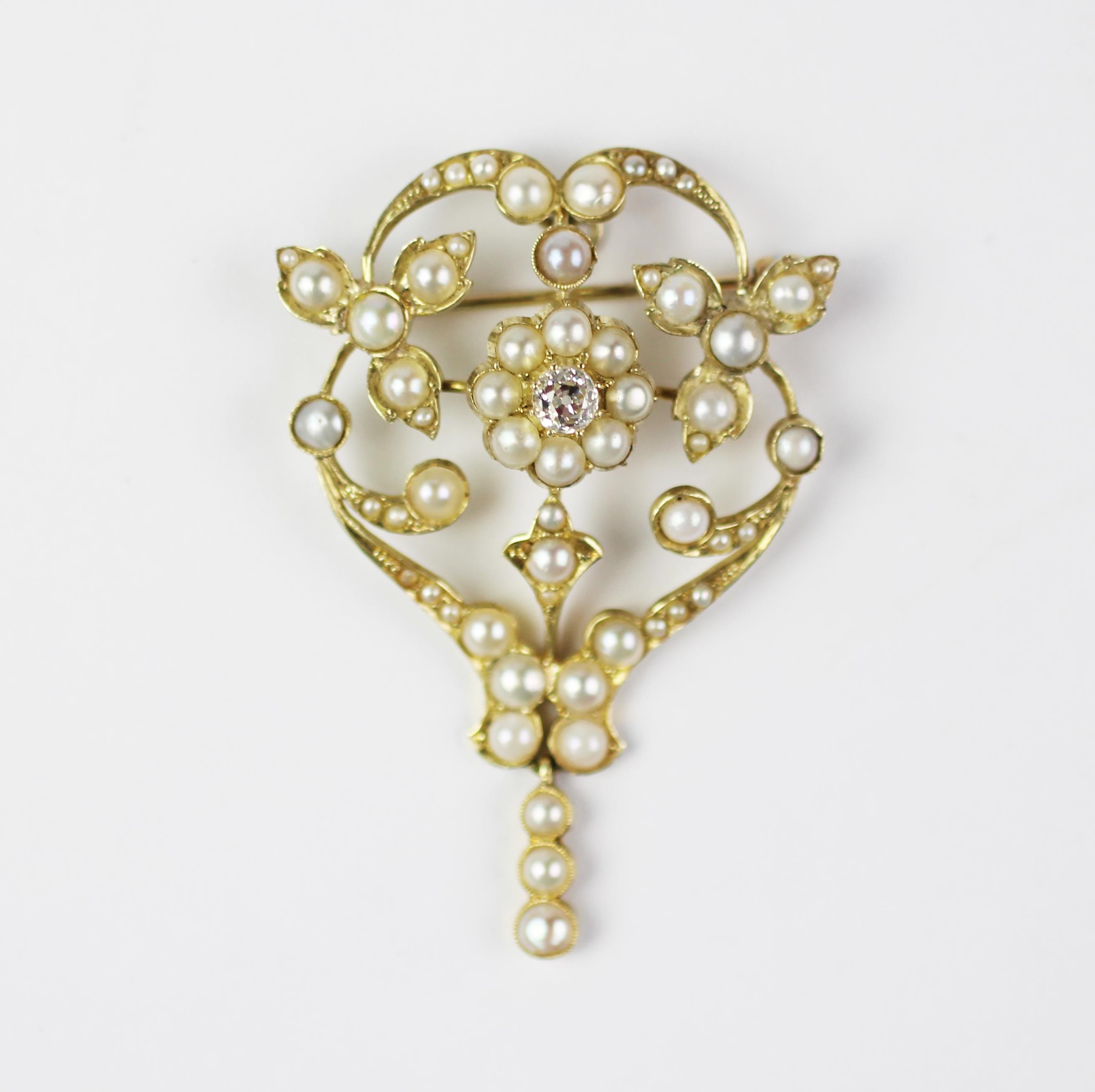 A Victorian diamond and split seed pearl set brooch/pendant, of sinuous floral form,