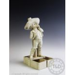 A white glazed novelty ceramic figural pipe rack in the form of a gentleman with large hat standing