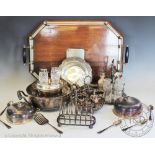 A selection of silver plated items to include; a butlers tray, a cruet, a toast rack,