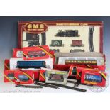 A collection of Hornby 00 Gauge tenders and carriages, a quantity of Tri-Ang track,