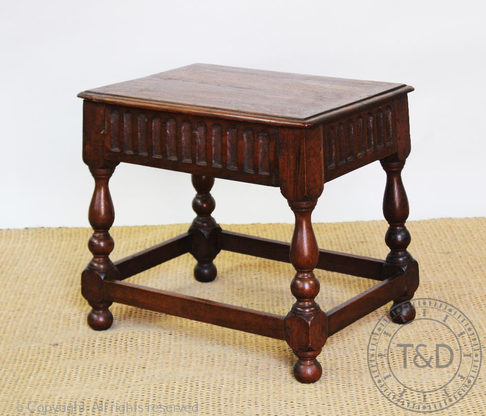 A 17th century style oak stool, on turned legs, 43cm H x 47.5cm W x 34.