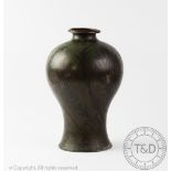 A WMF Ikora metal vase designed by Paul Haustein, of baluster form and decorated with floral motifs,
