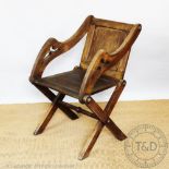 An early 20th century oak Glastonbury chair,