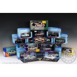 Twenty-four boxed diecast police cars by various makers including; Auto Art, Vanguards,