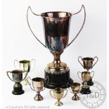 A large silver plated trophy of two handled form and upon socle base, not engraved, 43cm high,