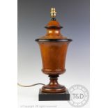 A modern turned wood table lamp, of vase form, on square base,