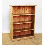 A pine dwarf open bookcase, with four shelves, 107cm H x 80.5cm W x29.
