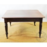 A 19th century mahogany extending dining table, with turned octagonal legs and fitted brass castors,