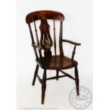 A 19th century beech and ash country chair, with solid seat, on turned legs,