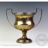 The Challenge cup, a George V silver two handled trophy of waisted pedestal form,