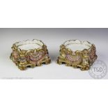 A pair of 19th century porcelain vase stands in the Rococo style,