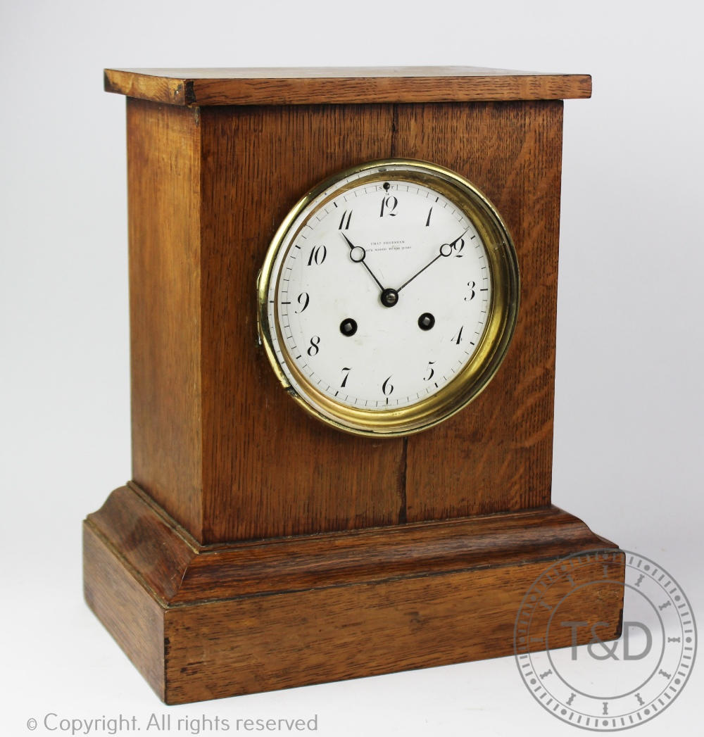An early 20th century oak cased eight-day mantel clock by Charles Frodsham,