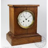 An early 20th century oak cased eight-day mantel clock by Charles Frodsham,