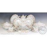 An Austrian porcelain Bridal Roses pattern dinner service, comprising: twelve dinner plates,